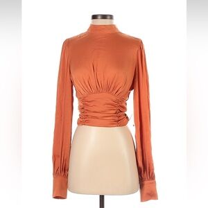 Free People orange silky high neck, open back, top size small.